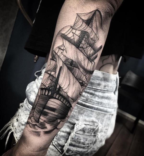 Black and grey sailboat forearm tattoo 3