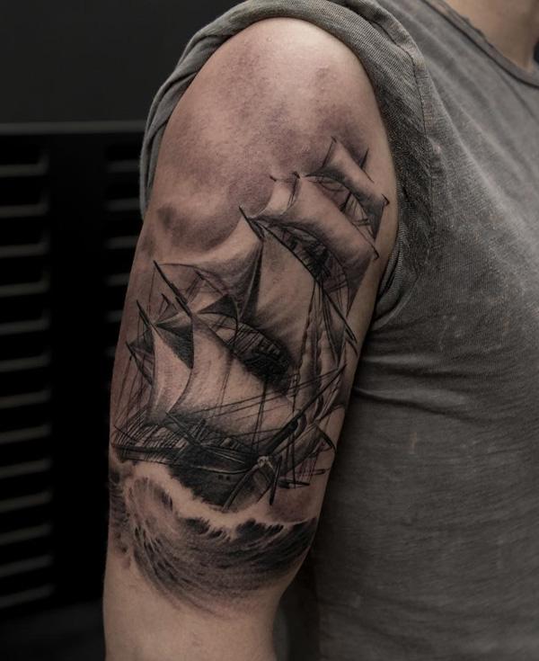 Ship in wave half sleeve tattoo