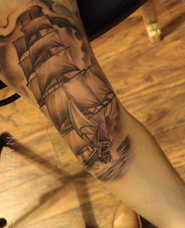 Negative space sailboat leg tattoo 