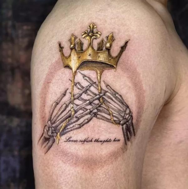 Hand skeleton and melting crown with quote