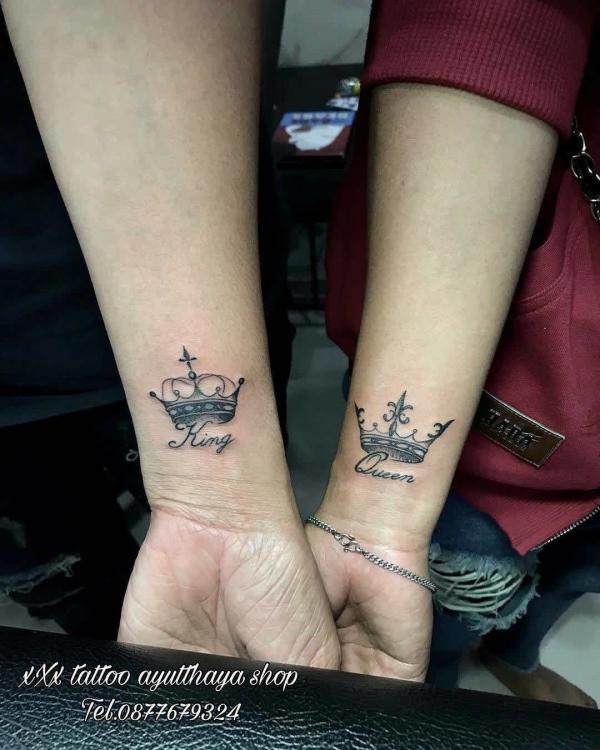 King and queen crown matching tattoo on wrist