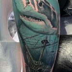 Realistic Shark and sunken ship tattoo