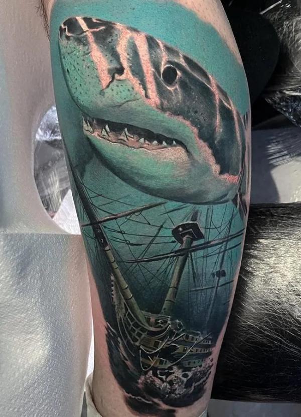 Shark and sunken ship tattoo