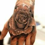 Realistic rose tattoo with water droplets