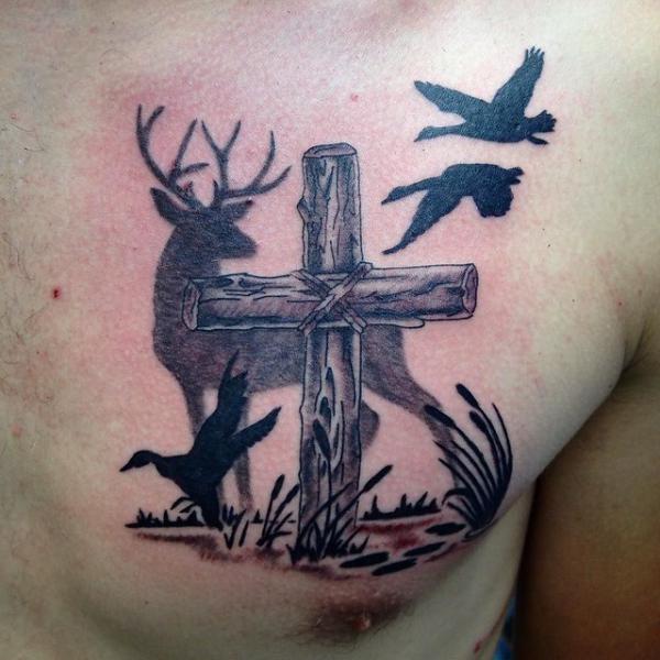 Deer and cross tattoo