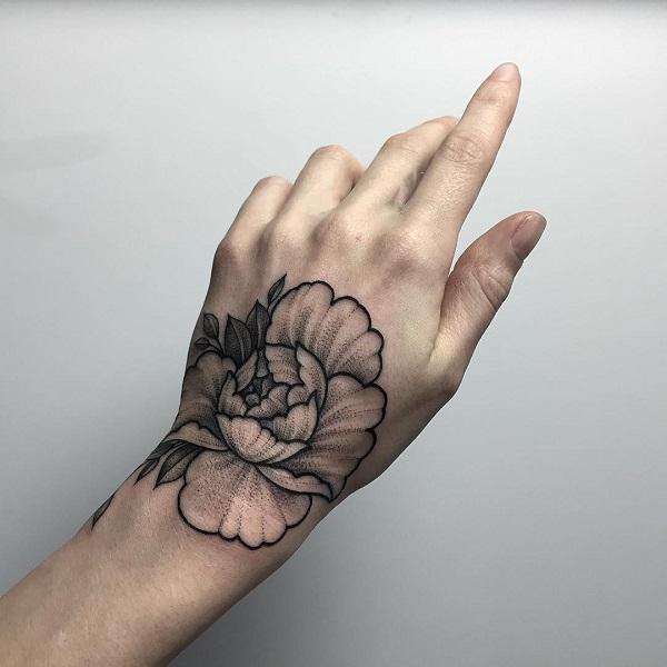 These tiny floral tattoos make up a flower garden on this girls hand and  were so in awe  HelloGigglesHelloGiggles