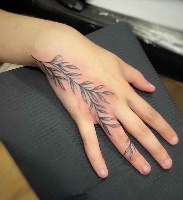 Palm tree tattoo on the left hand