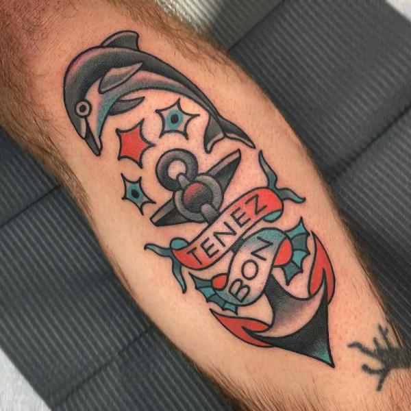 American traditional anchor with dolphin tattoo