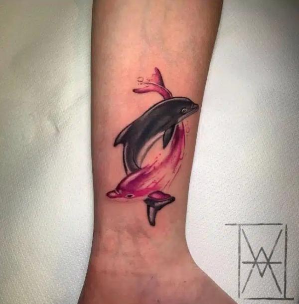 Black and red dolphin Pisces tattoo