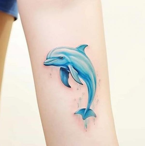 Blue dolphin tattoo