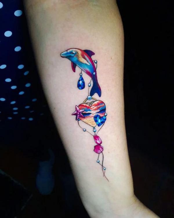 Colorful dolphin with pendant of diamond heart and shell tattoo