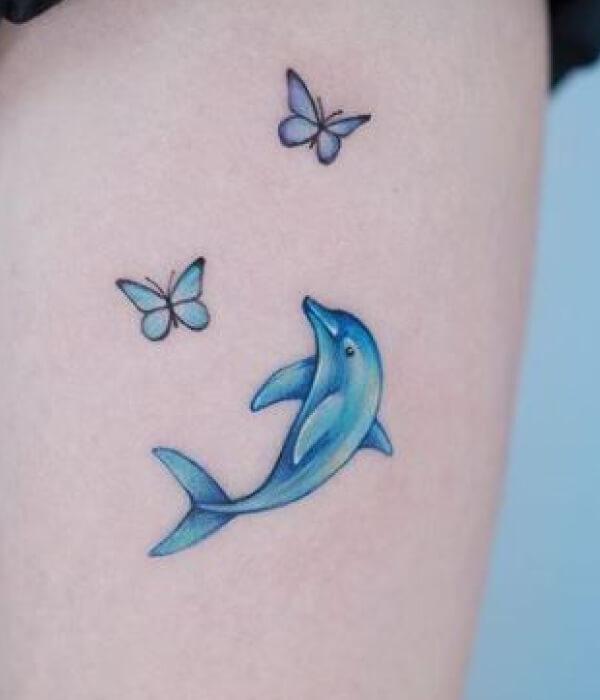 Dolphin and butterfly tattoo