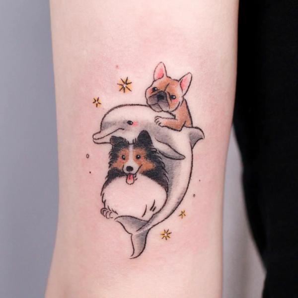 Dolphin and dogs tattoo