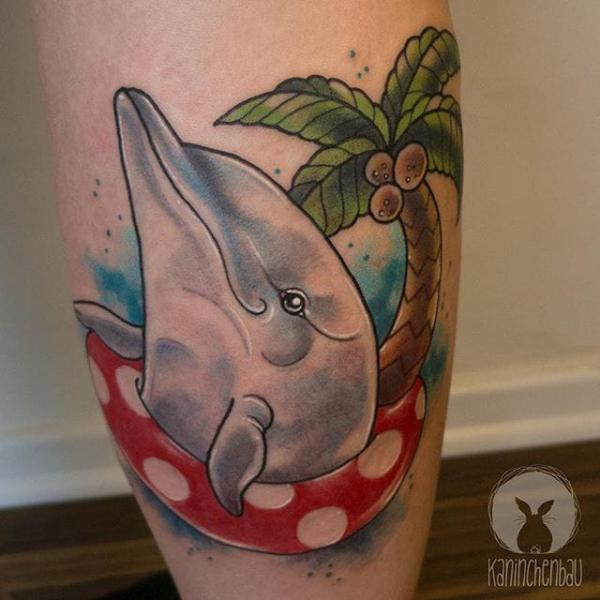 Dolphin and palm tree tattoo traditional