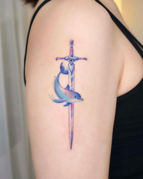 Dolphin and sword tattoo