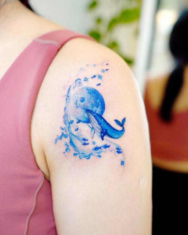 Dolphin fish and moon shoulder tattoo