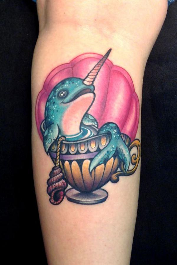 Dolphin in bowl with shell tattoo