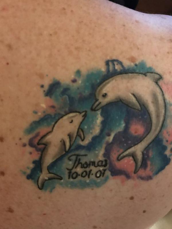 Dolphin mother and baby with name tattoo