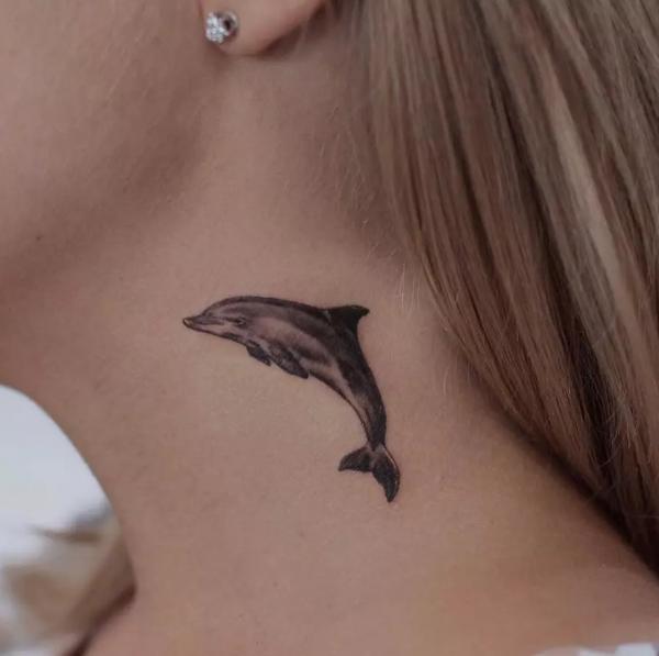 Dolphin neck tattoo