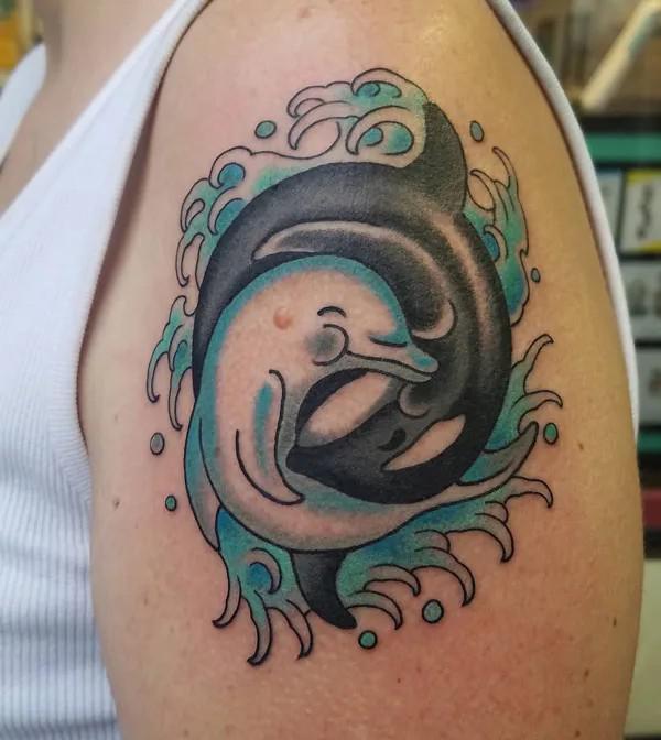 Dolphin yin yang shoulder tattoo