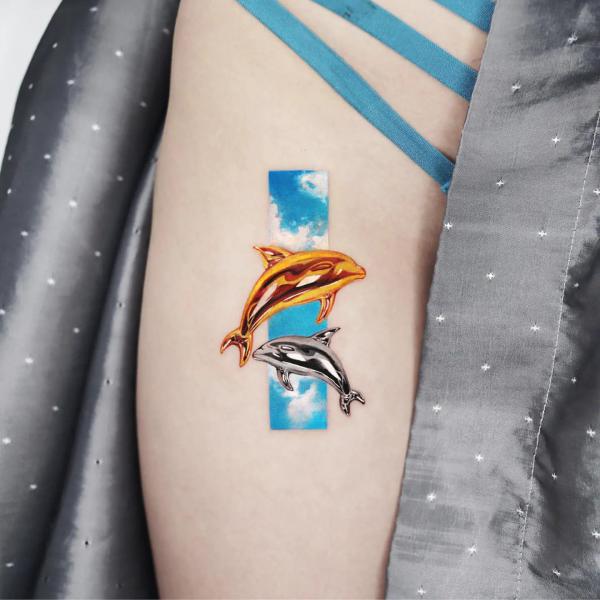 Golden and silver dolphin rectangular tattoo