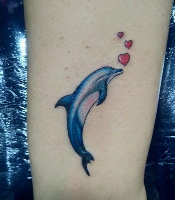 Realistic dolphin and hearts tattoo