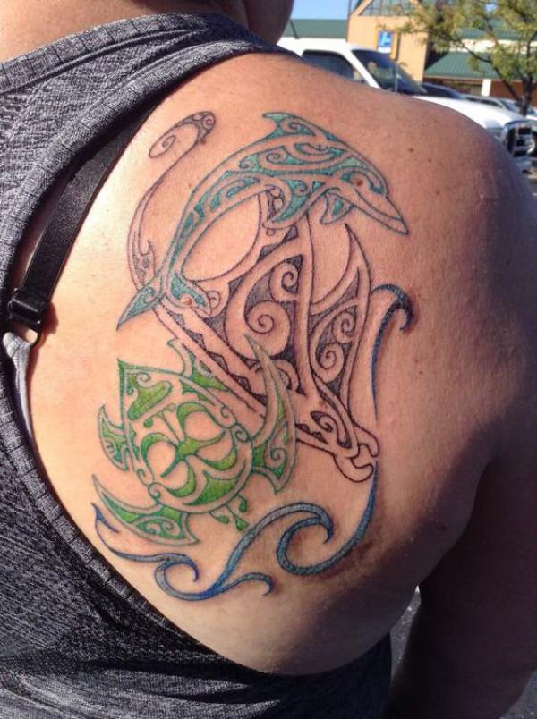 Tribal dolphin and ray tattoo