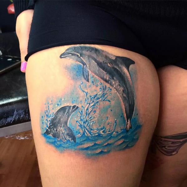 Two Dolphin thigh tattoo