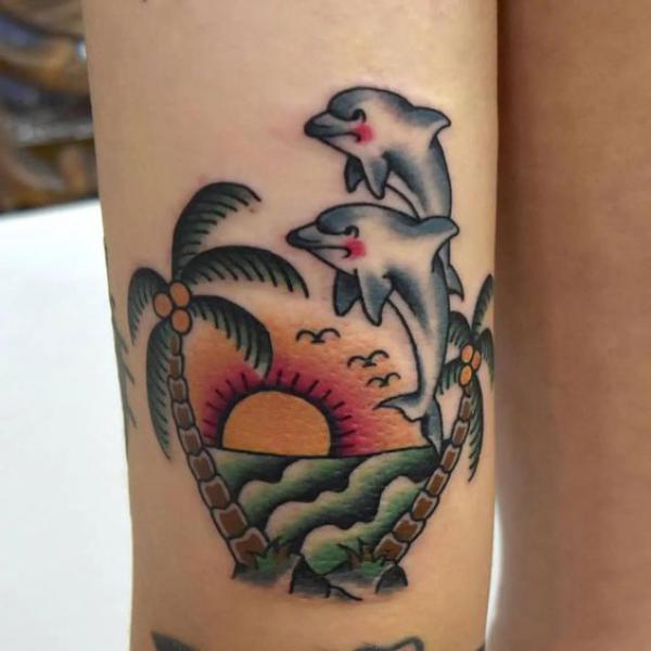 Two dolphin and palm tree sunset tattoo traditional