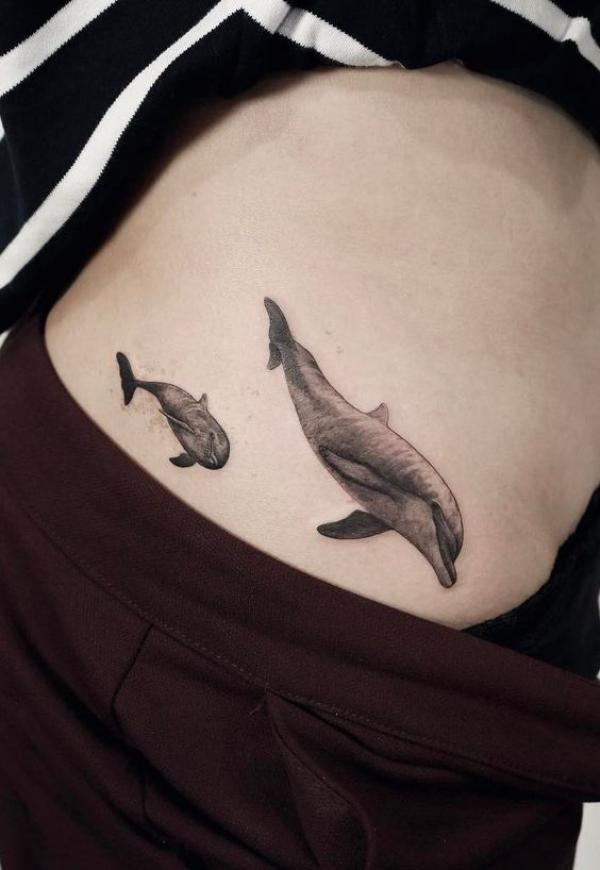 Two dolphin family tattoo