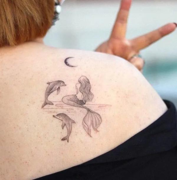 Two dolphin with Mermaid tattoo