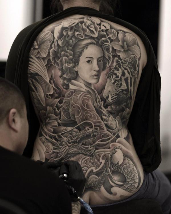 Black and grey geisha and dragon tattoo