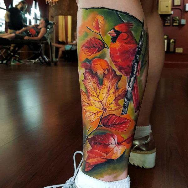 Colorful robin and maple leaves tattoo
