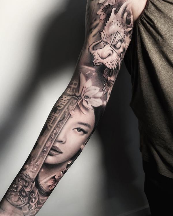 Dragon and geisha fave sleeve tattoo black and grey