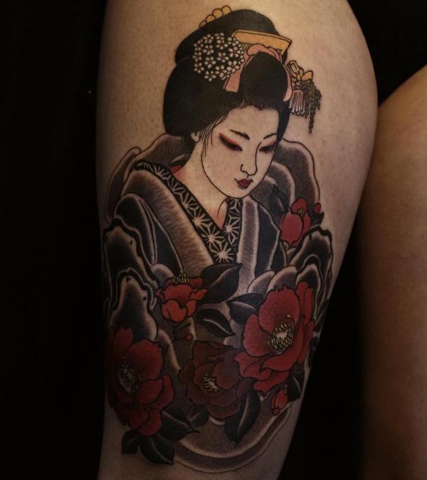 Geisha with camellia thigh tattoo