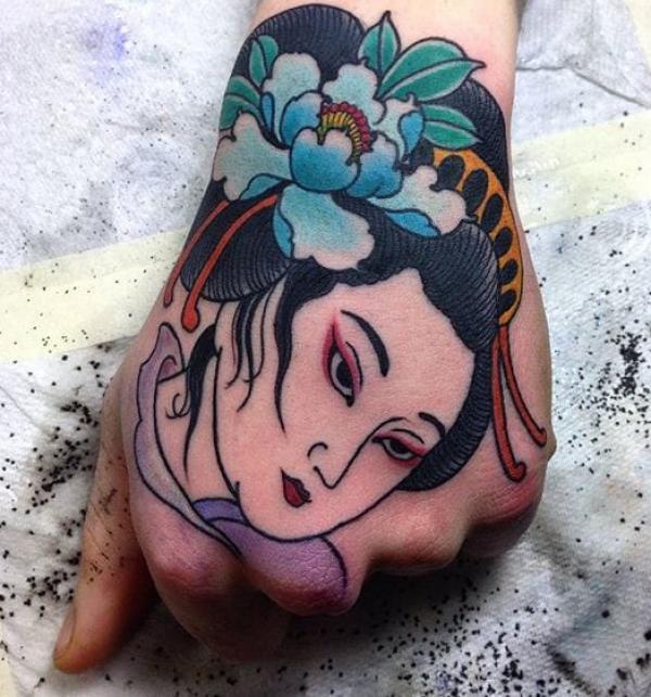 Geisha with flower hand tattoo