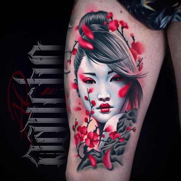 Geisha woman with watercolor cherry blossom tattoo