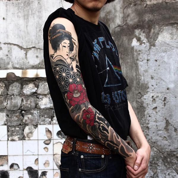 Japanese geisha and camellia tattoo sleeve