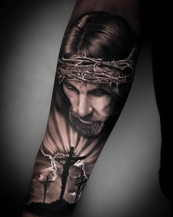 Jesus looking down the cross with halo