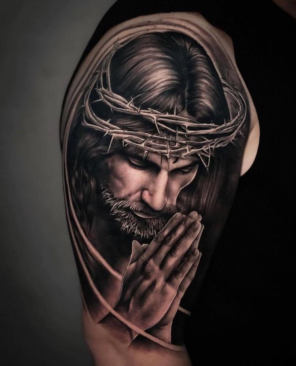 Jesus with crown of thorns and praying hands