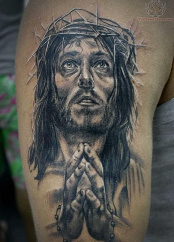 Jesus with praying hands tattoo