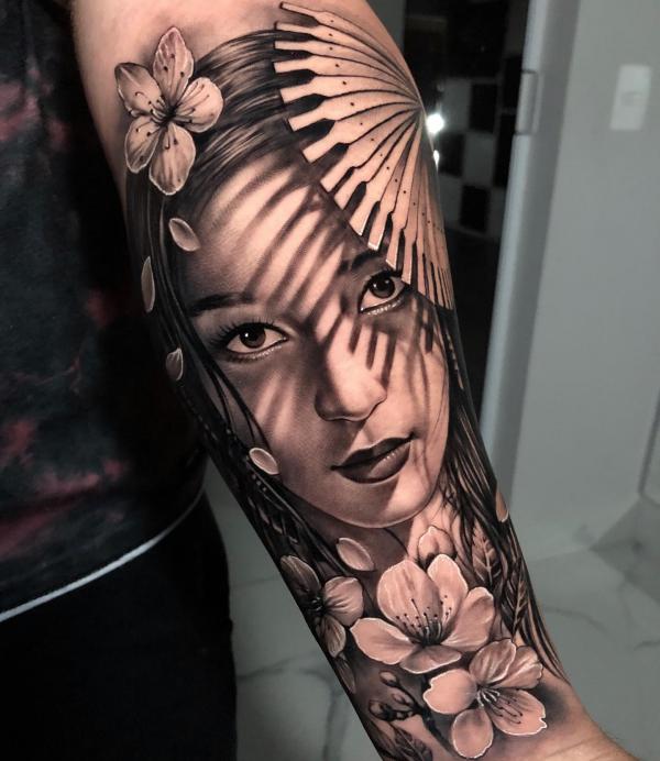 Realistic geisha under shadow with cherry blossom tattoo
