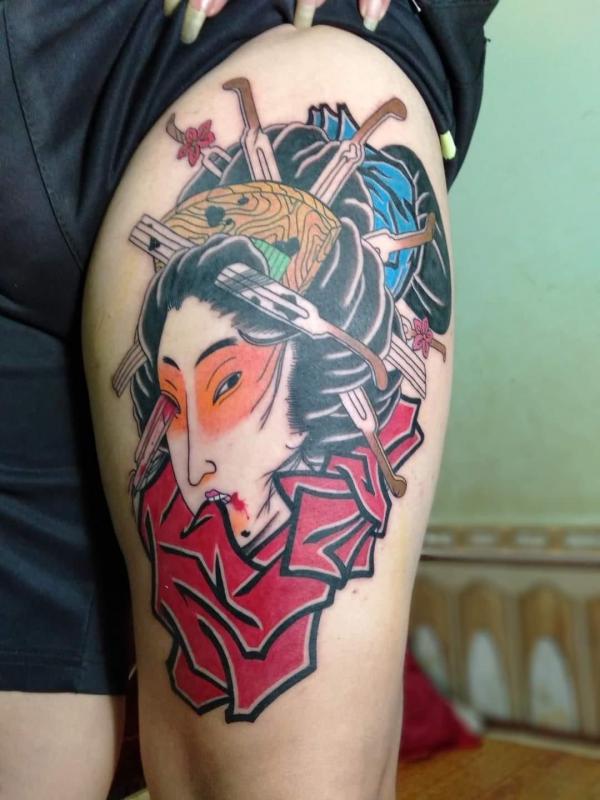 Thigh geisha portrait tattoo
