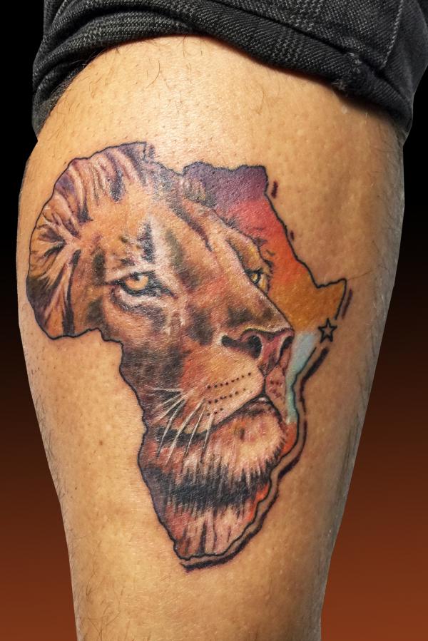 Lion face Africa map tattoo