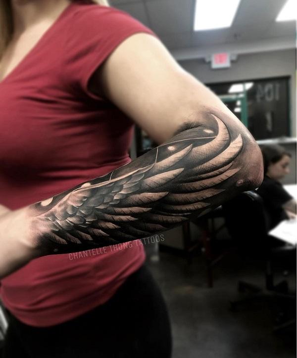wing tattoo forearm