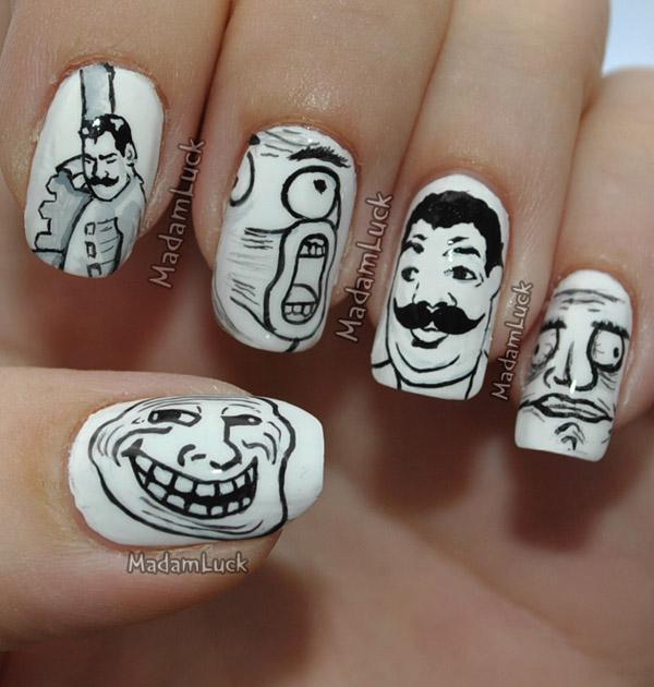 Black and white cartoon caricatures on the nails.