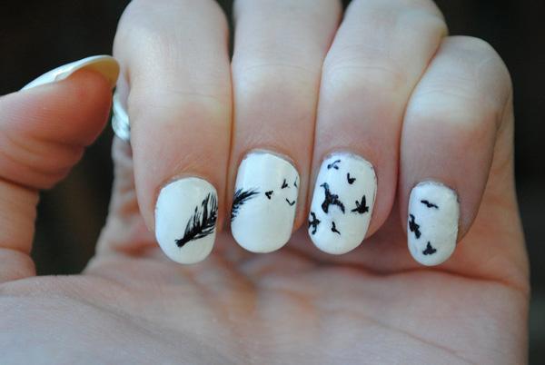 Feather and flying birds on black and white nails, a call for legendary journey.