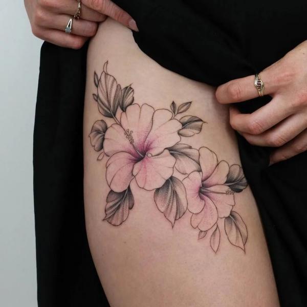 Dainty hibiscus thigh tattoo