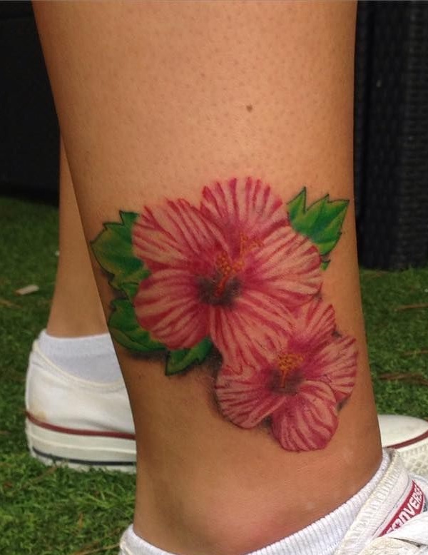 Red hibiscus tattoo on ankle