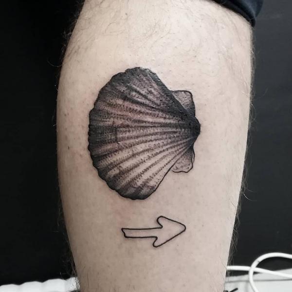 Camino with arrow tattoo